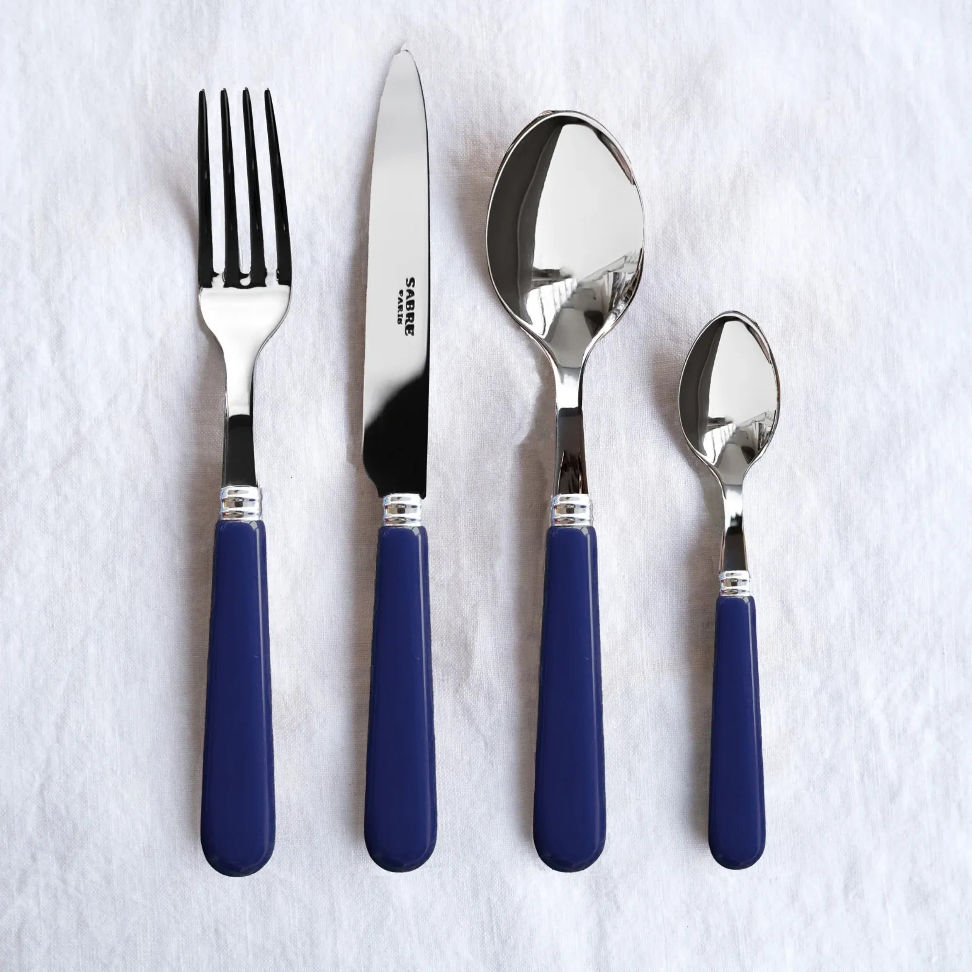 Stylish and durable Pop Unis Cutlery Set with stainless steel knives, forks, and spoons in a modern design, perfect for any dining table setting