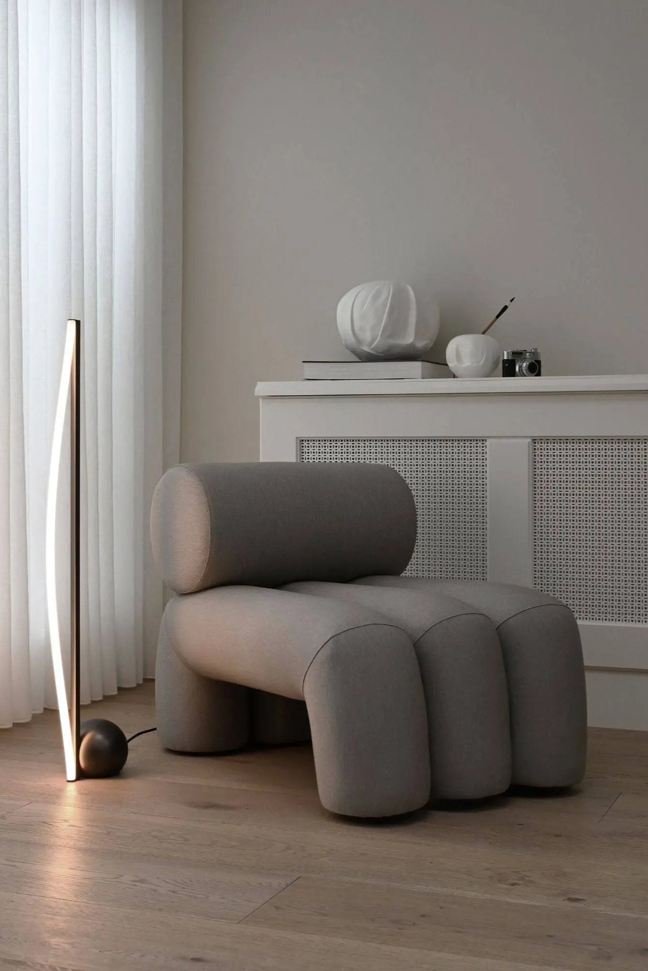 Close-up of Foku Lounge Chair's comfortable padded seat and armrests