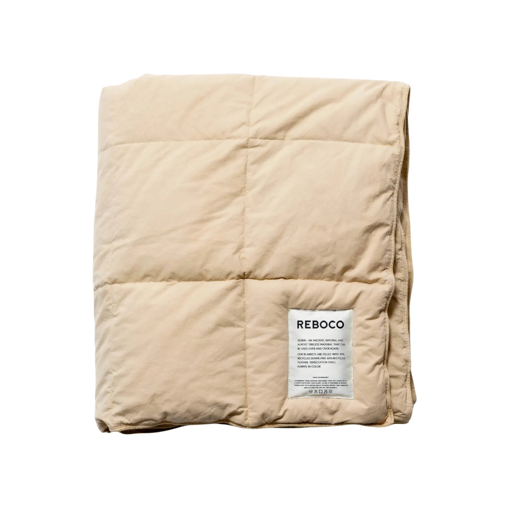 Soft and cozy down blanket in biscuit color draped on bed 