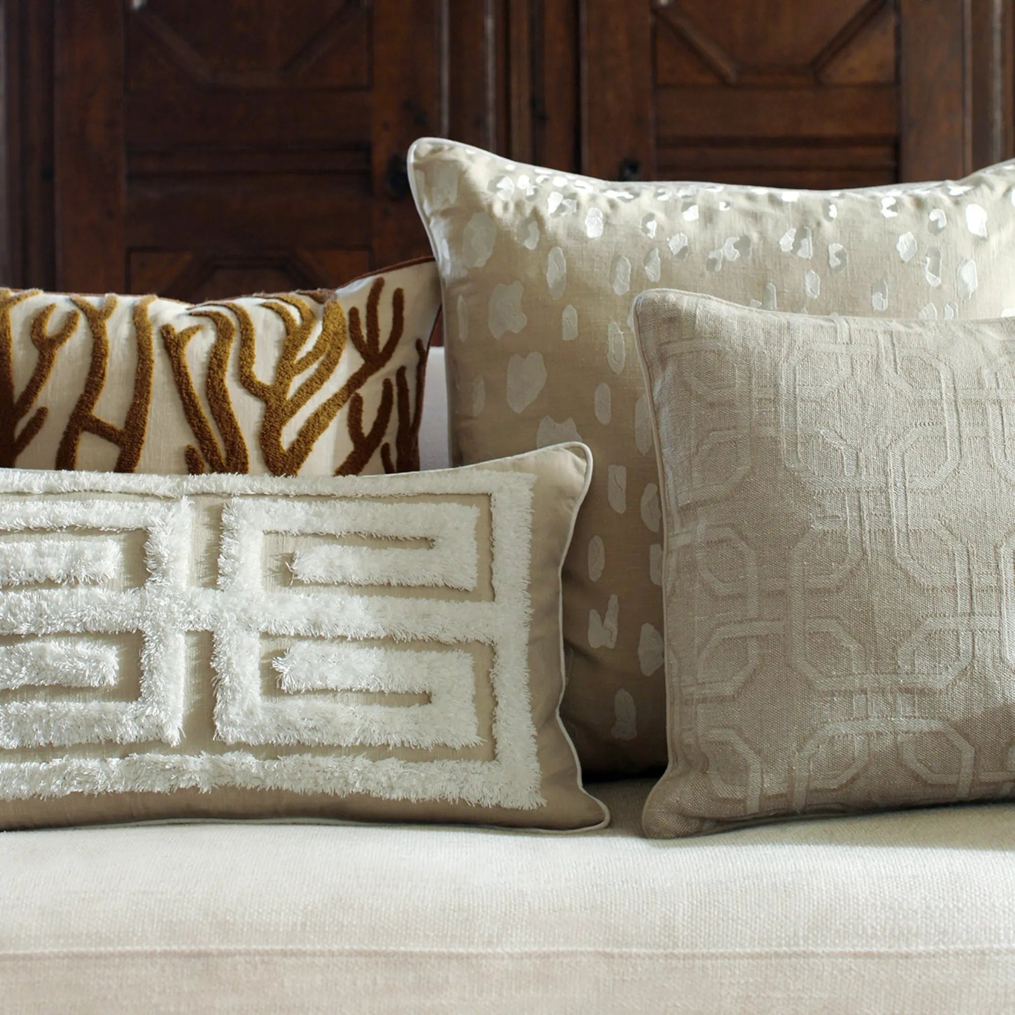 Beautiful Cleo Cushion Cover with intricate embroidered details and soft, luxurious fabric in a neutral color palette, perfect for adding elegant style to any room