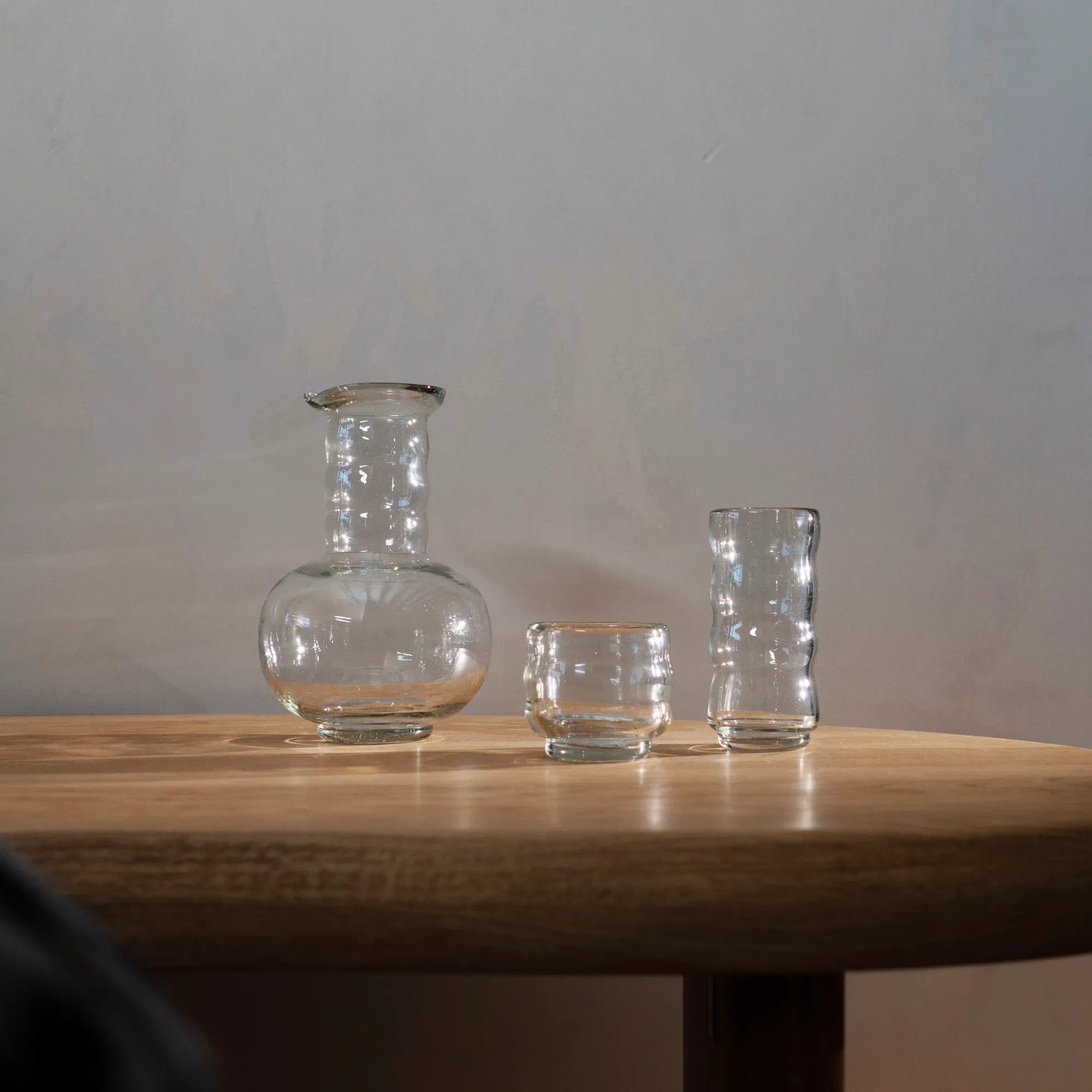 Beautiful hand-blown glass Agnes Carafe with elegant curved design and slender neck