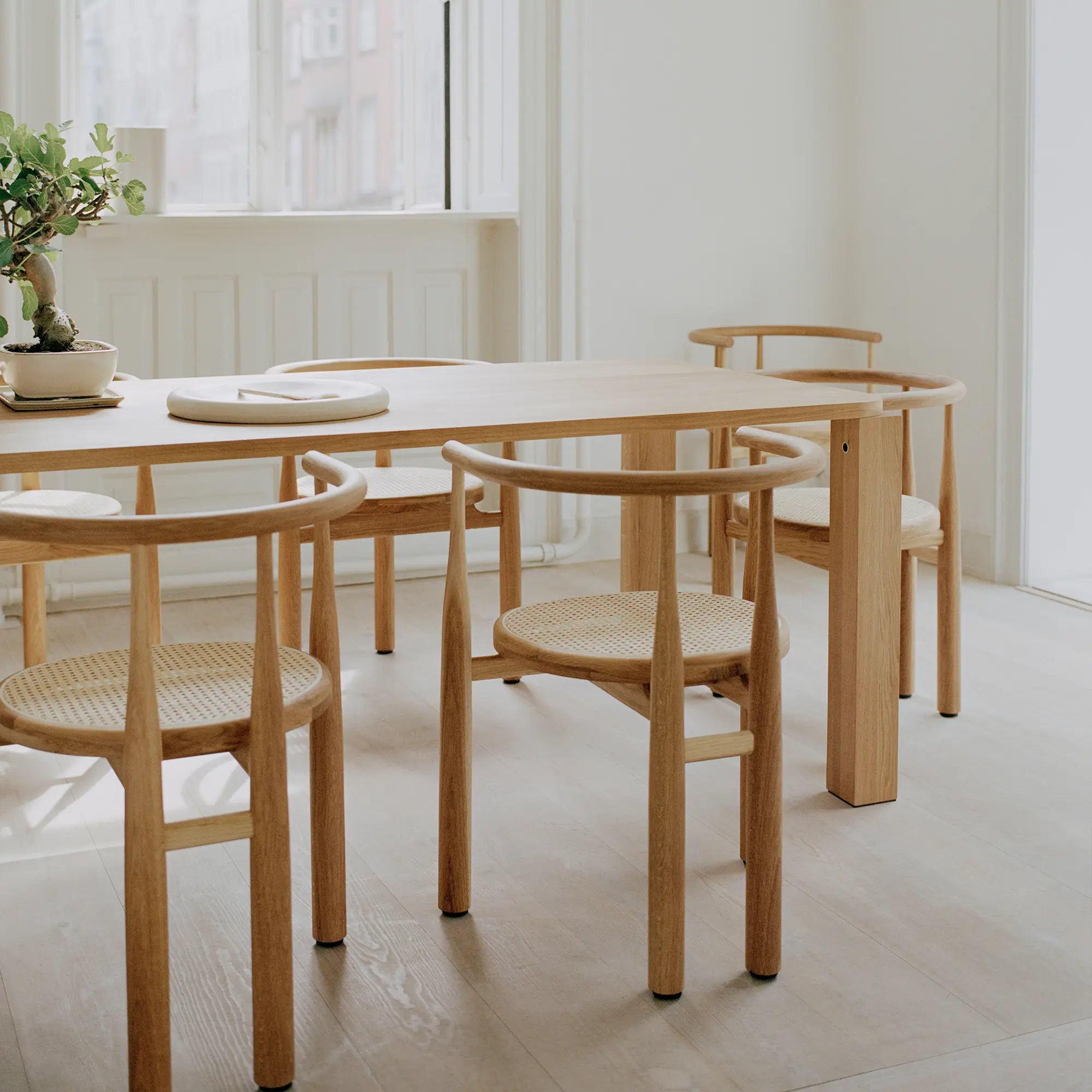 Elegant Bukowski Dining Chair - French Cane in natural wood finish