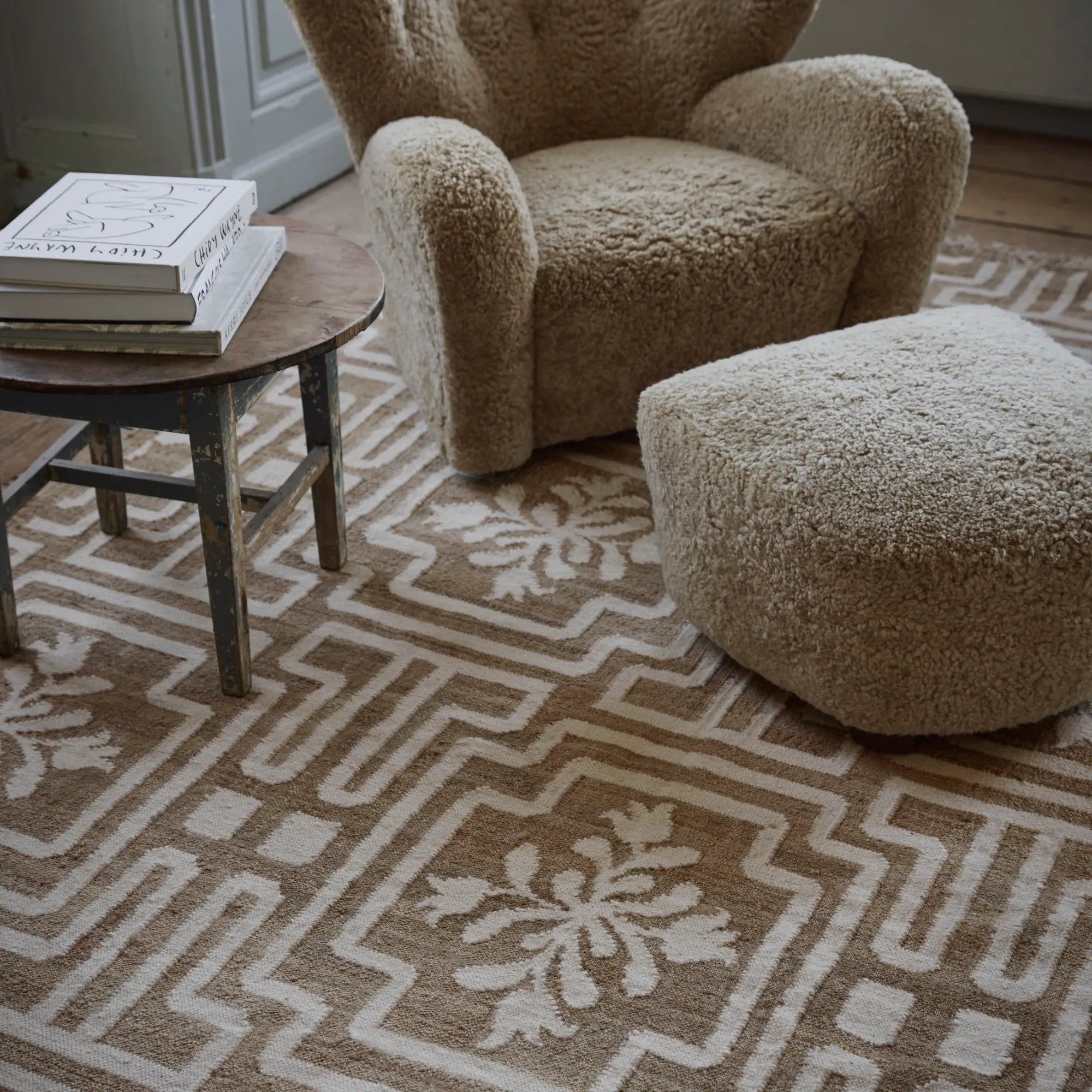  Living room with elegant handwoven beige and blue wool rug No22 as the centerpiece