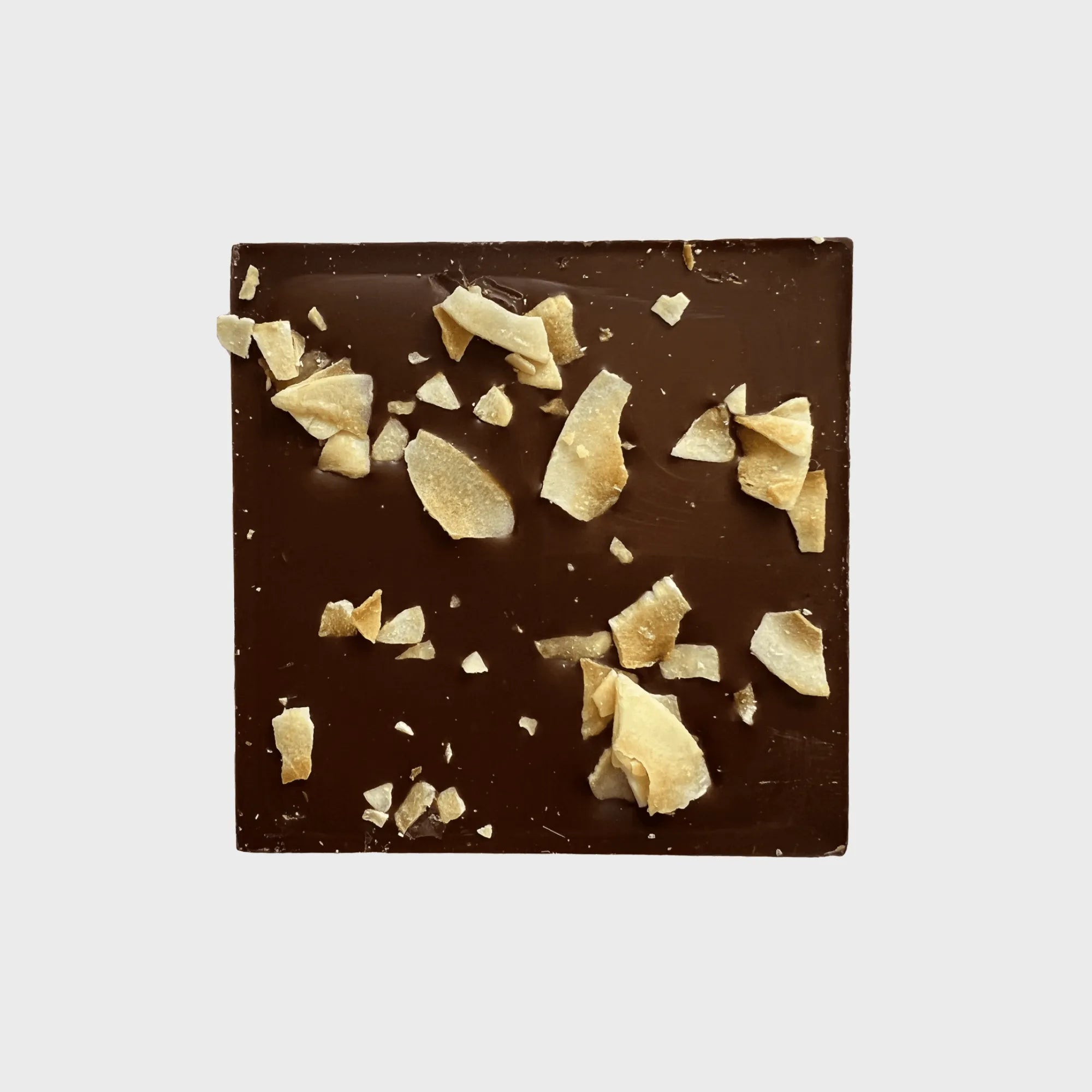 Artisanal dark chocolate bar with 51% cocoa, featuring caramelized coconut flakes for a decadent and indulgent treat