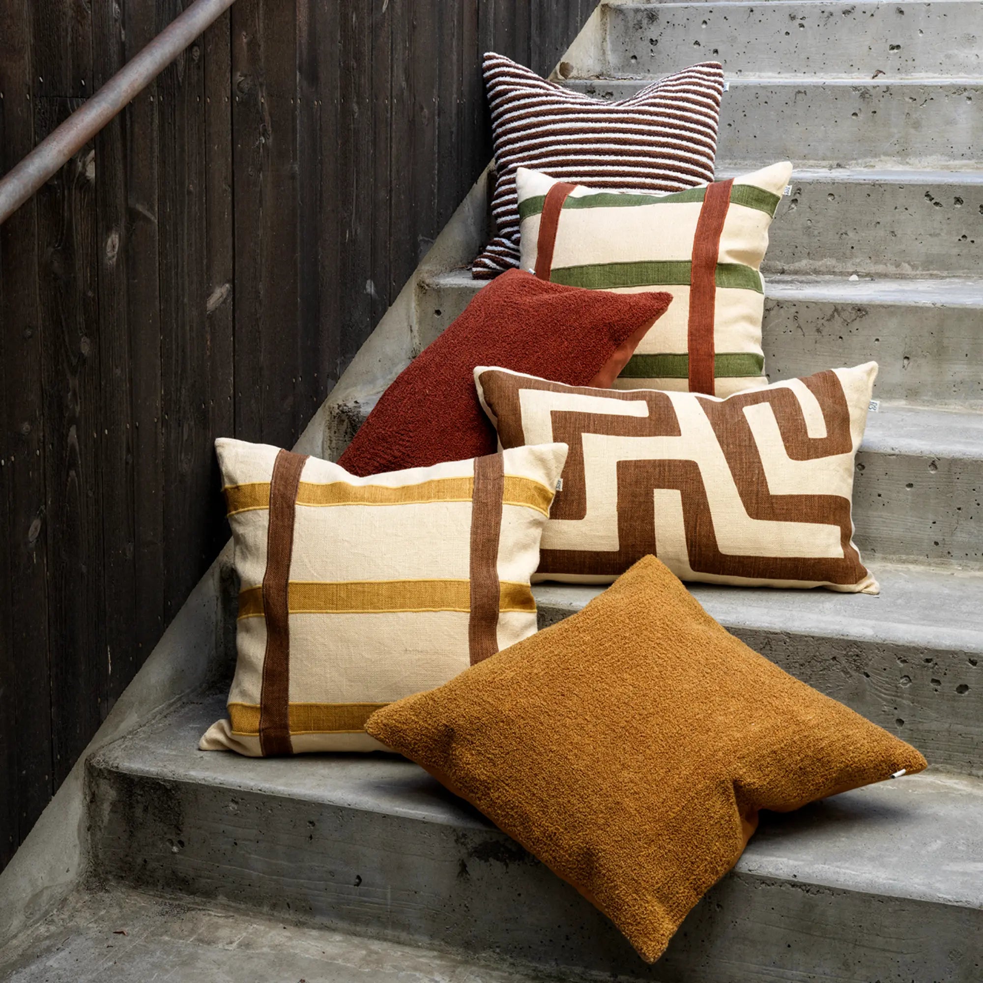 Close-up of Nagra Cushion's intricate embroidery and textured details