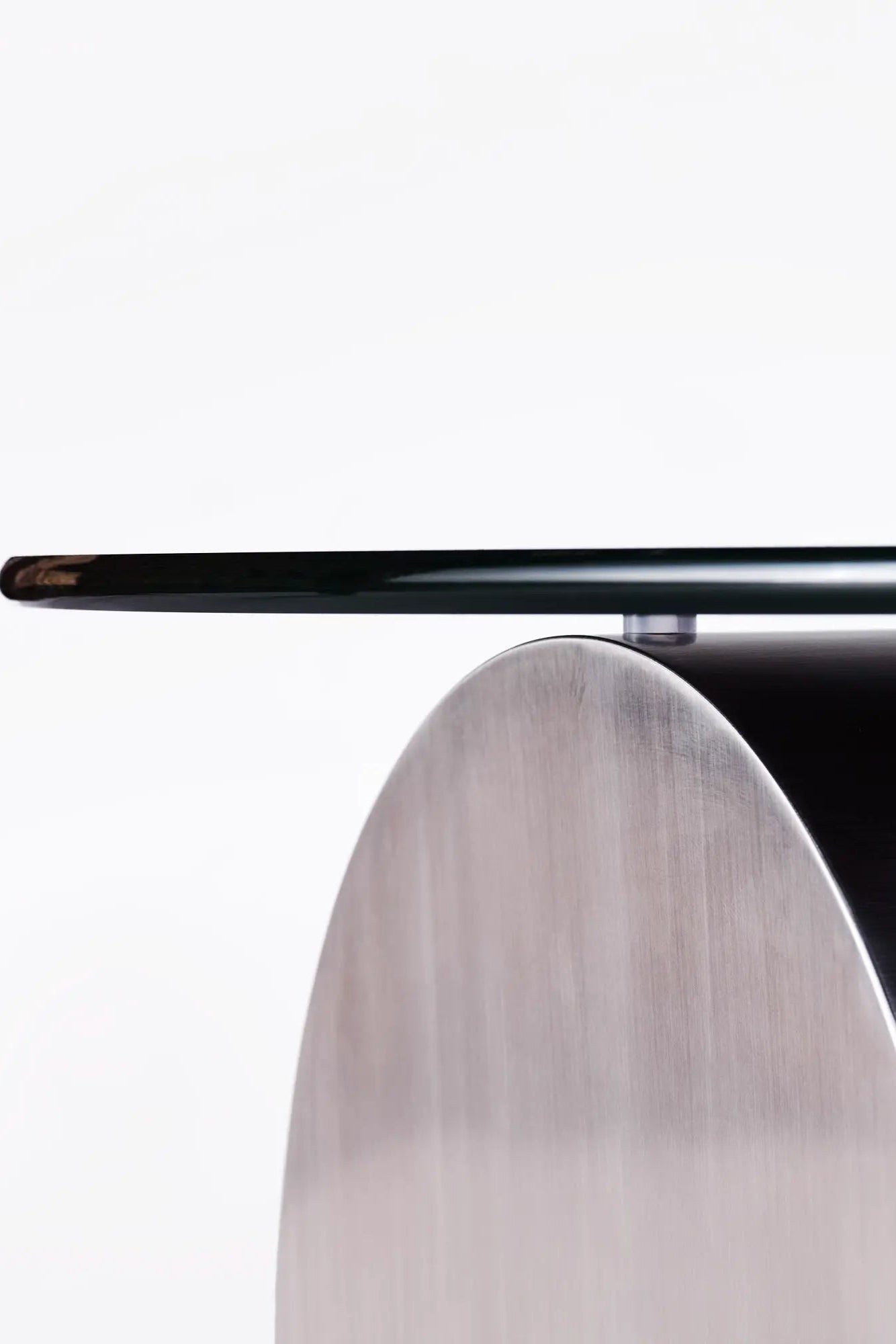 A modern and sleek Cross Sofa Table in dark wood finish