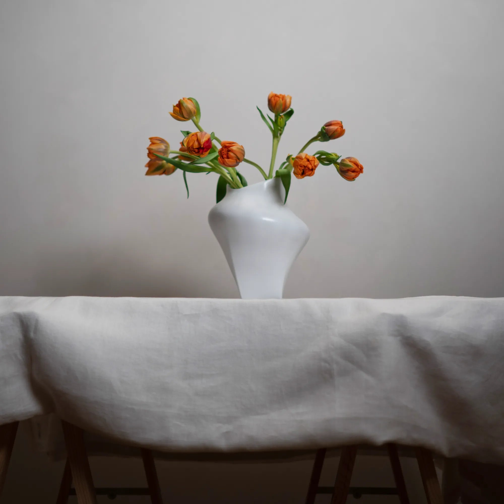 Nami Vase displayed on a wooden shelf with natural lighting