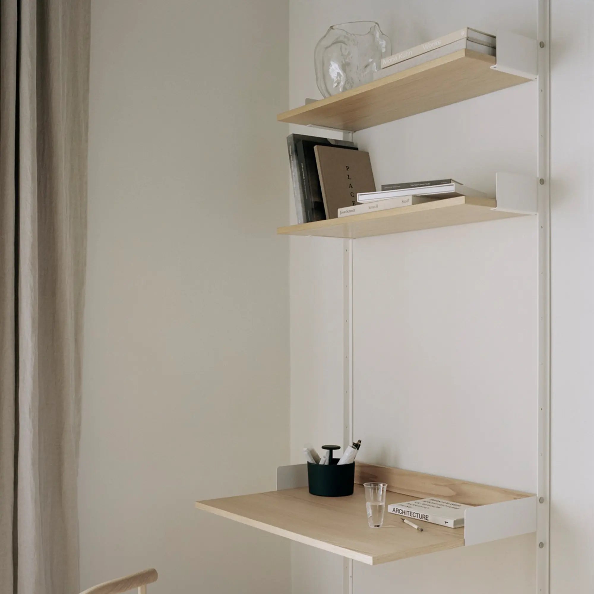  Study shelf in a cozy home office with natural light and comfortable chair