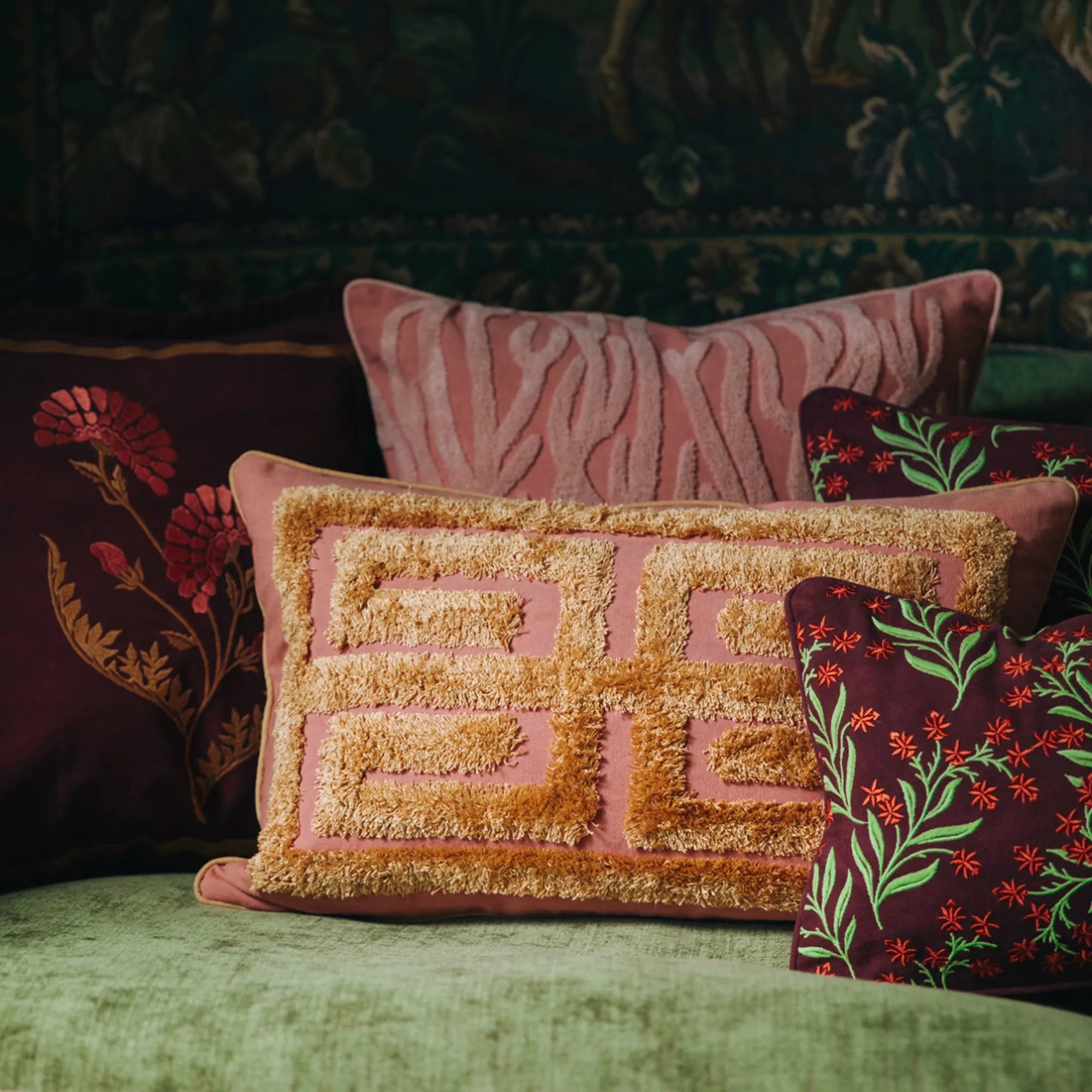 Cleo Cushion featuring a bold floral design in shades of blue and green