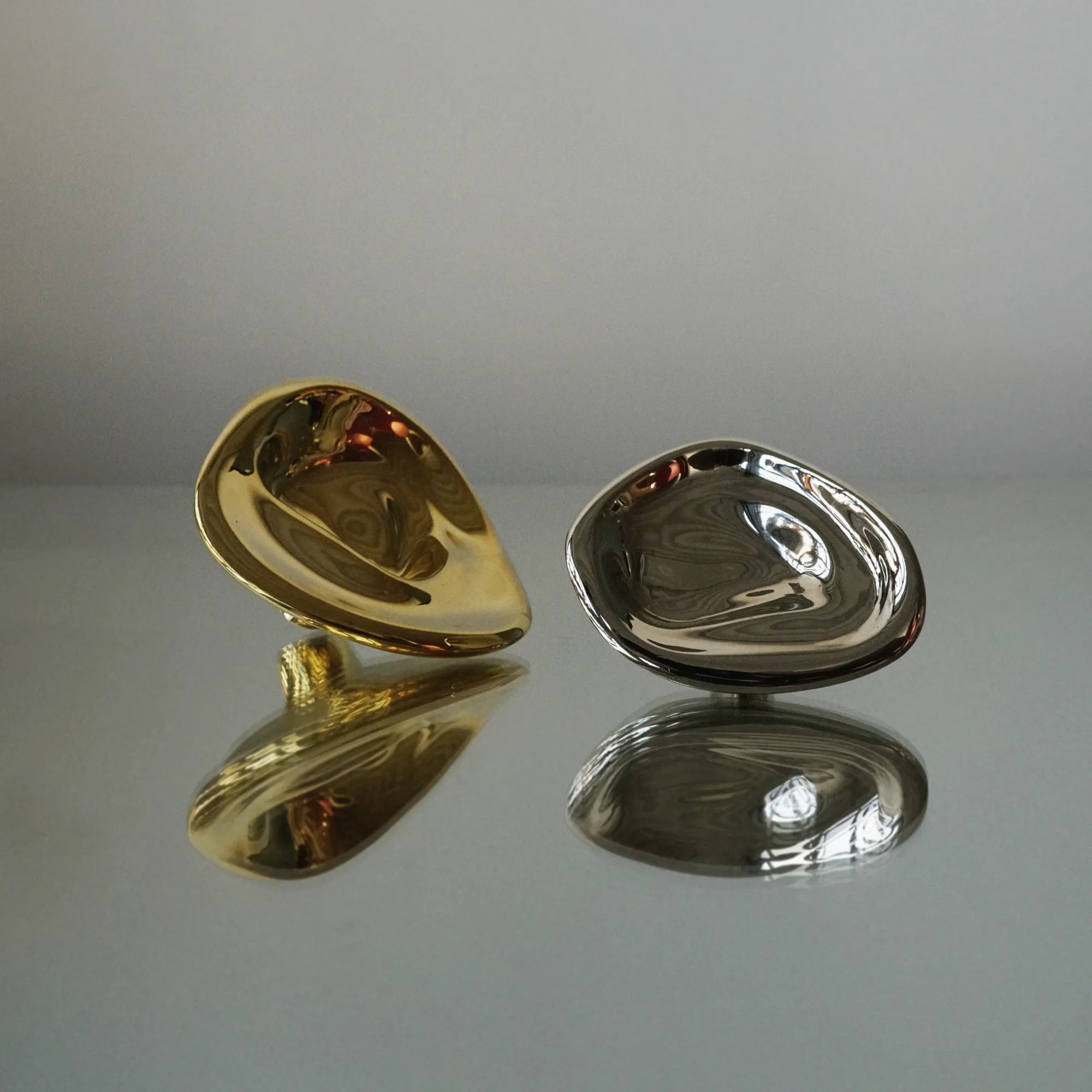  Close-up of small Ripple Knob in polished brass finish