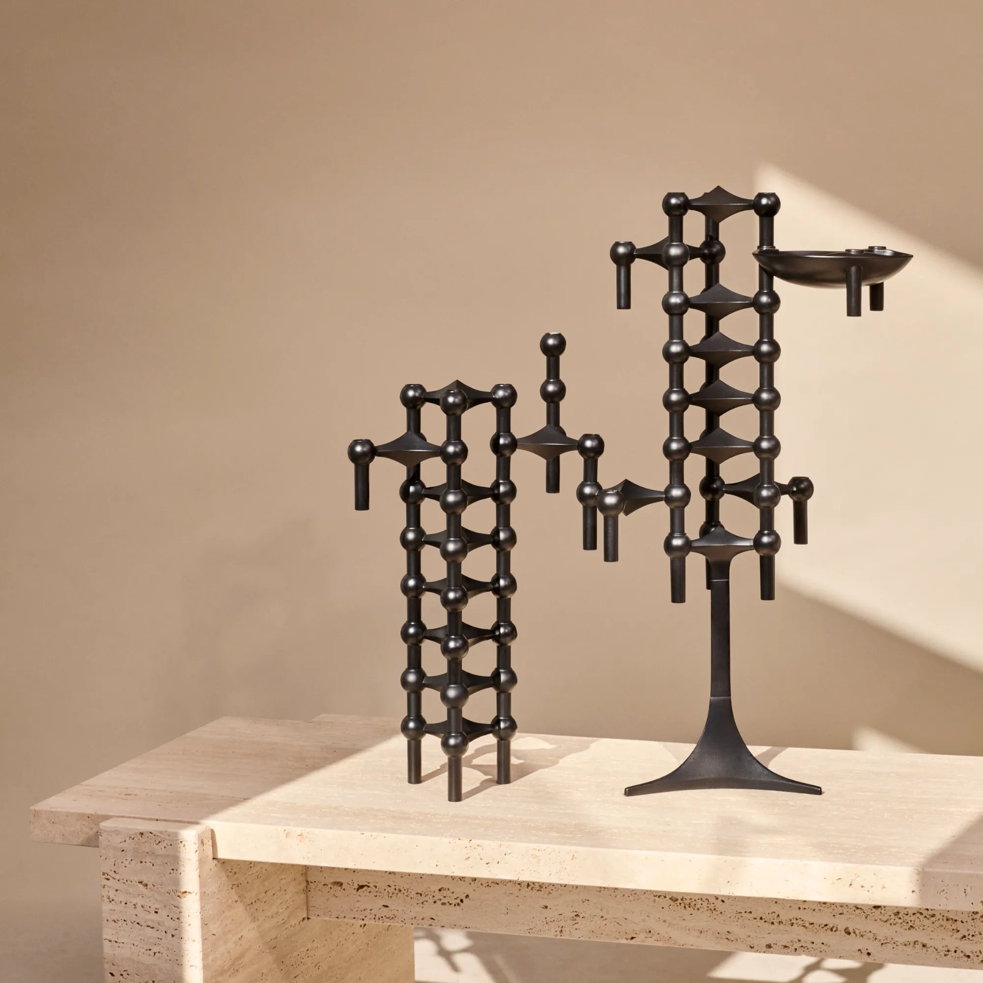 Modern and sleek black modular candle holder arrangement