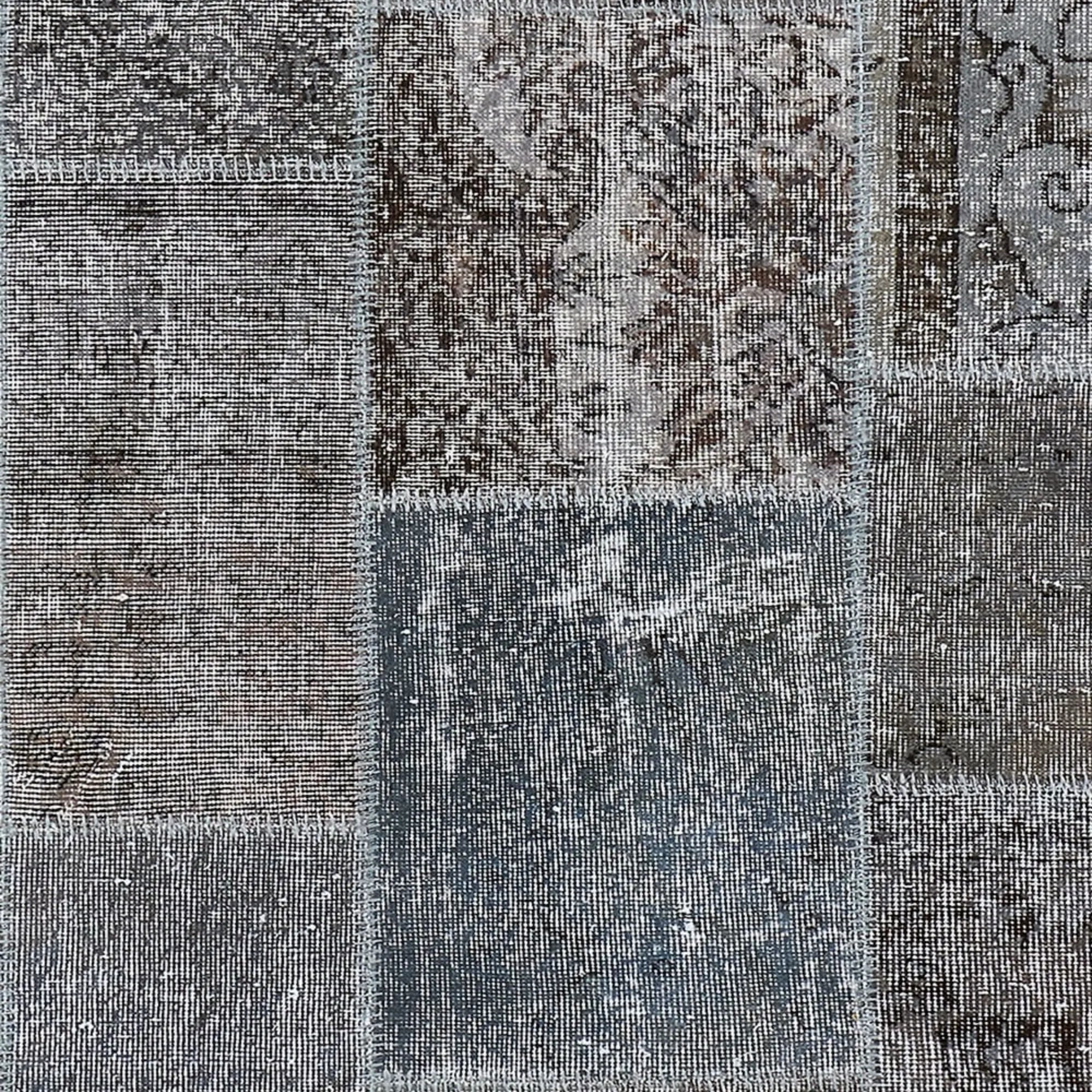 Traditional handwoven tapestry with faded, time-worn appearance