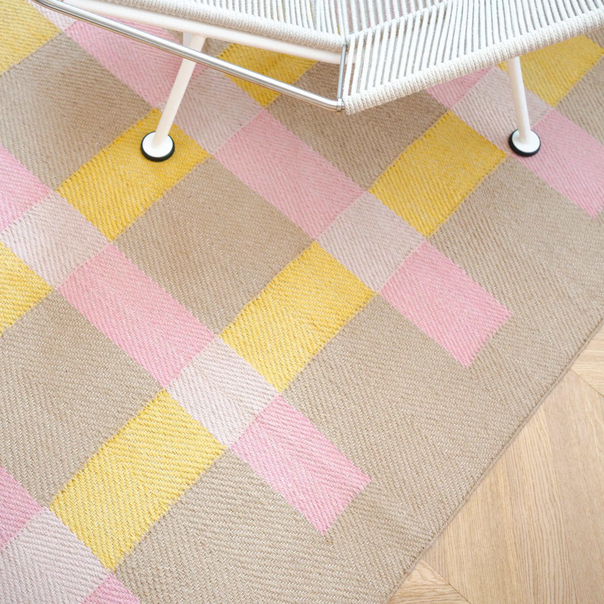 Handwoven jute rug featuring a striped pattern in earthy tones