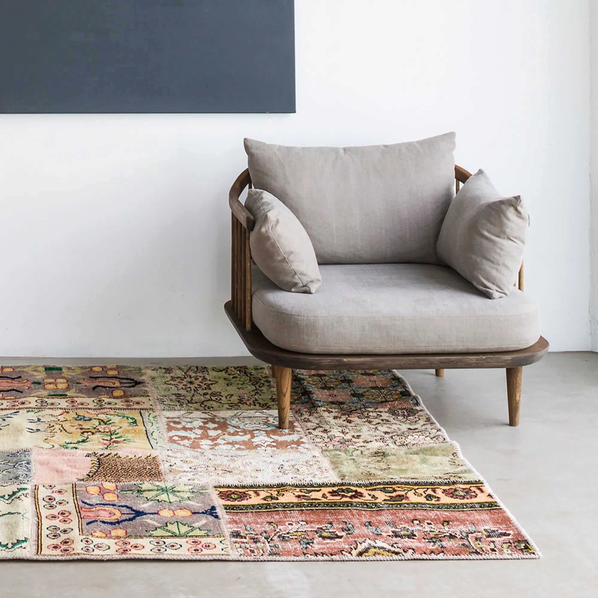 Handwoven vintage rug with intricate red and blue floral patterns